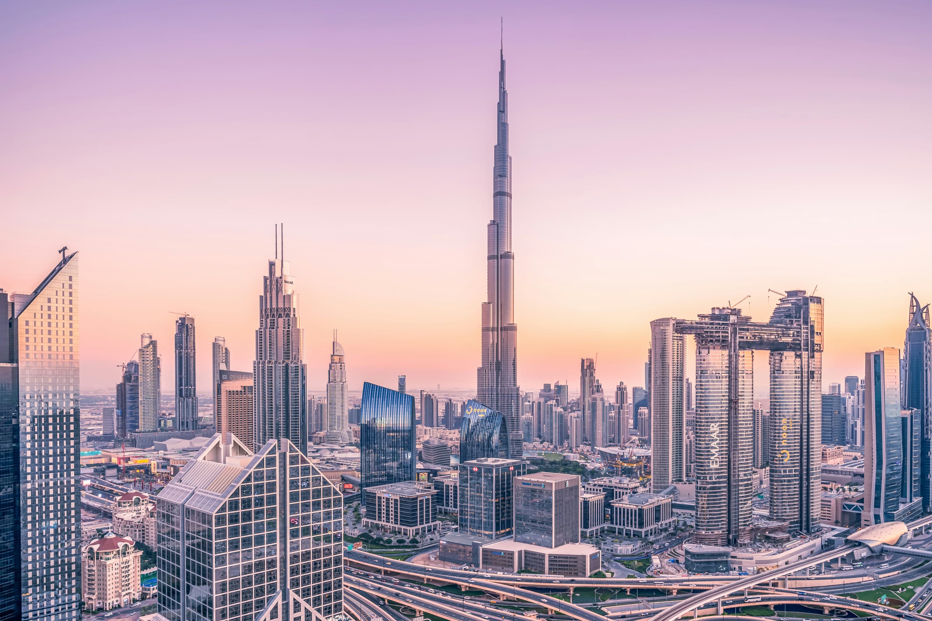 Downtown Dubai at sunset, with the Burj Khalifa and Business Bay