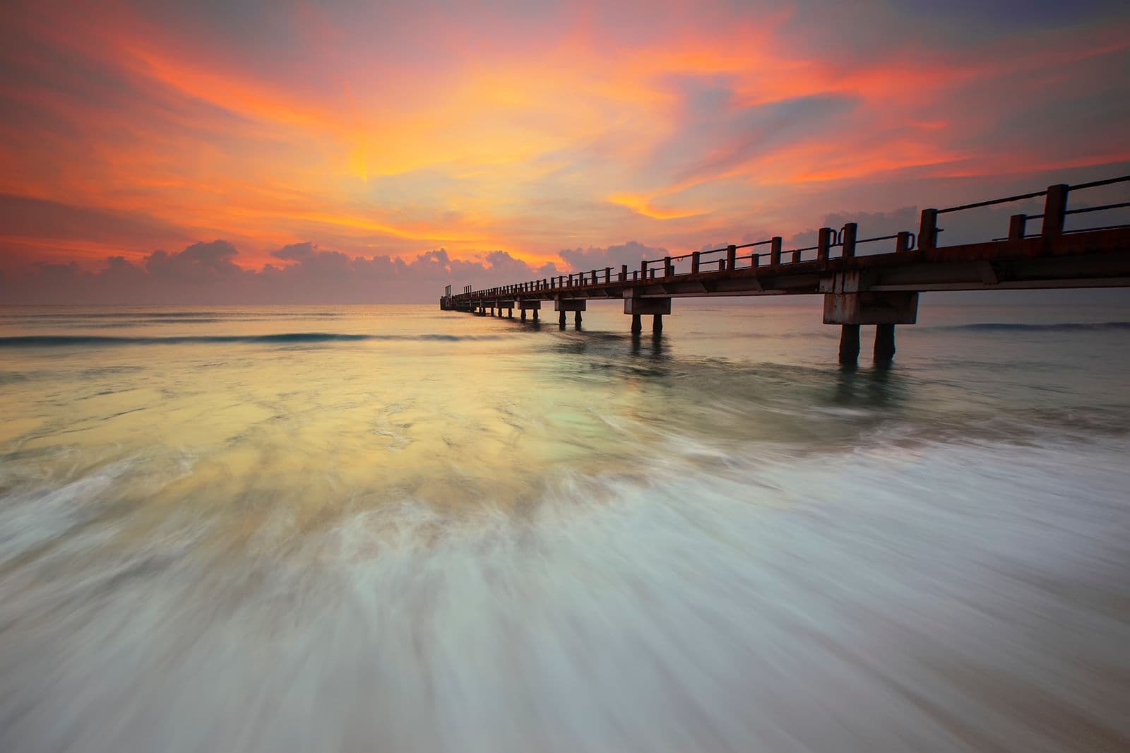 Calm coastal pier at sunset, Umm Al Quwain, United Arab Emirates